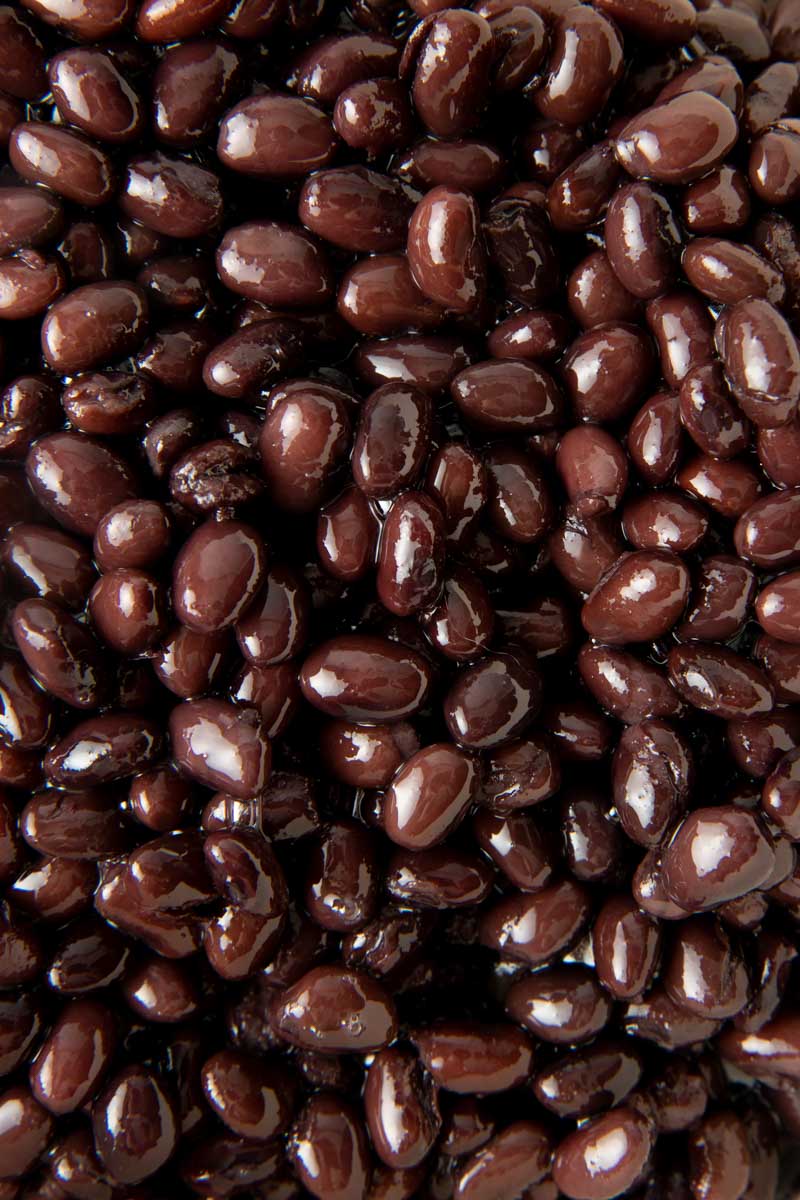 Close-up of perfectly cooked seasoned back beans.