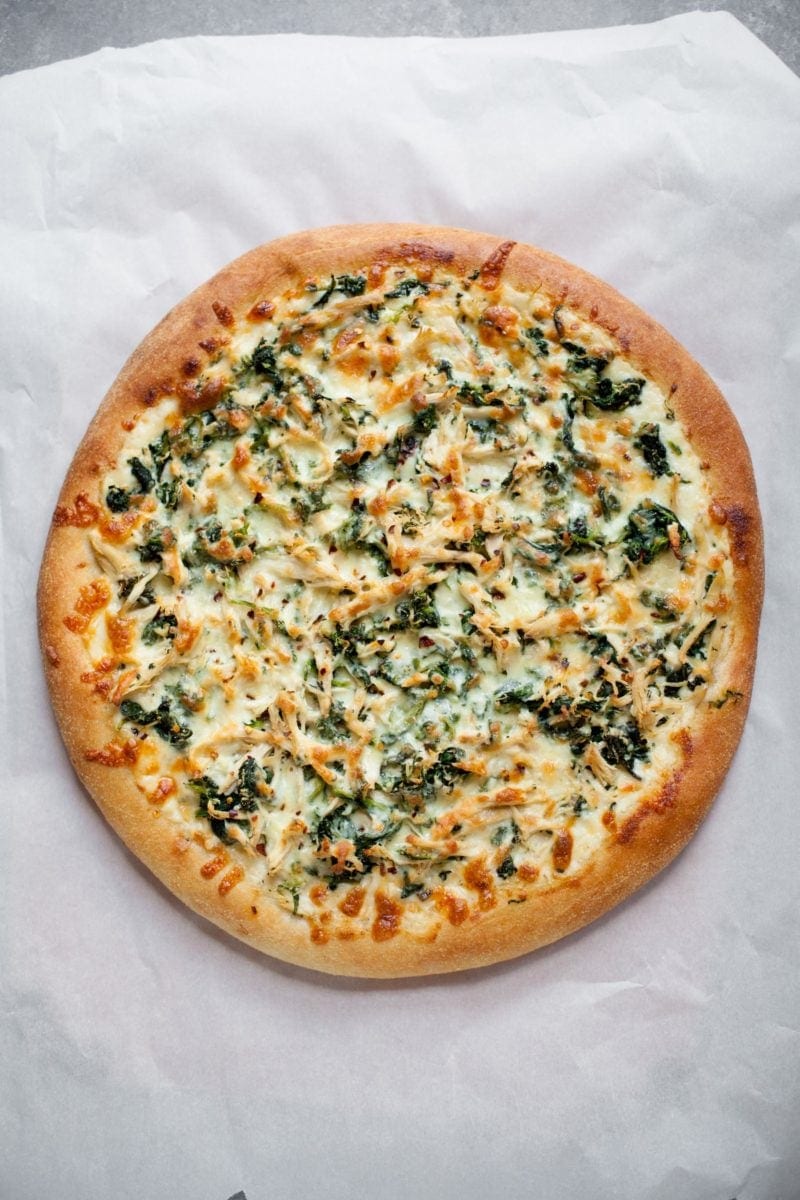 Overhead shot of cooked Chicken Spinach Alfredo Pizza