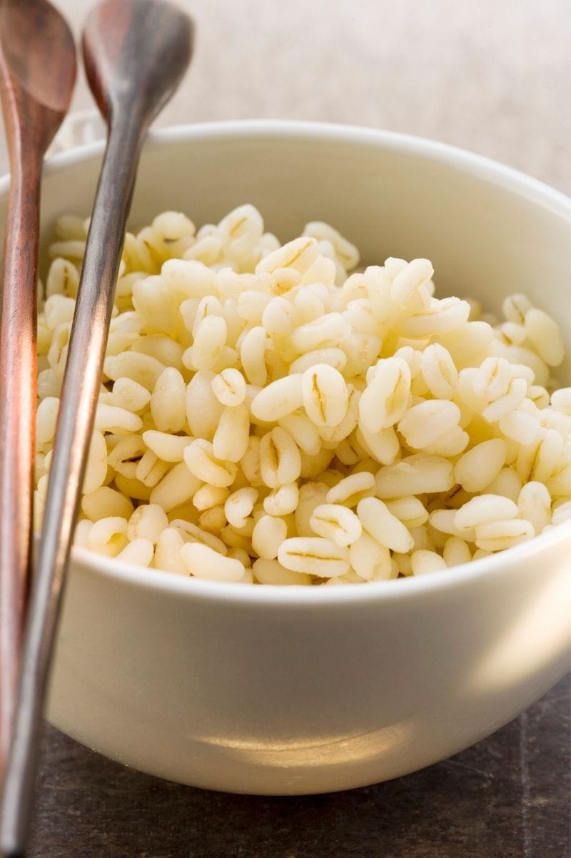 Close view of plump cooked grains in a bowl.