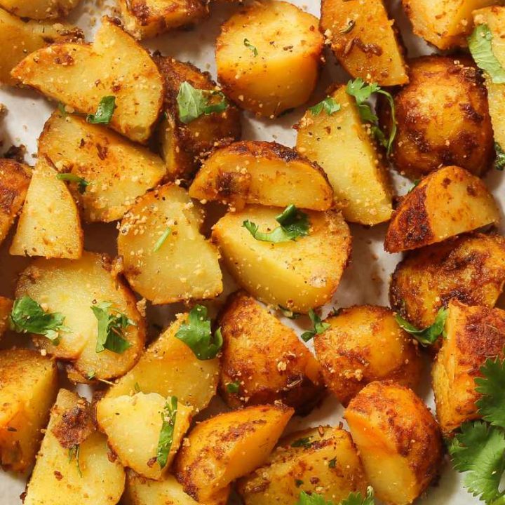 Garlic roasted potatoes garnished with chopped flatleaf parsley.