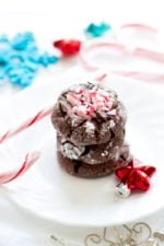 Stack of three chocolate peppermint cookies on a white plate