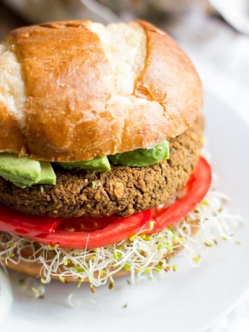 Pumpkin Black Bean Burger sits on a white plate.