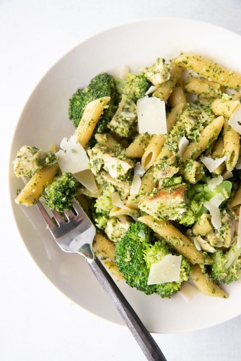 Overhead of a bowl of pasta with a fork loaded with a bite.