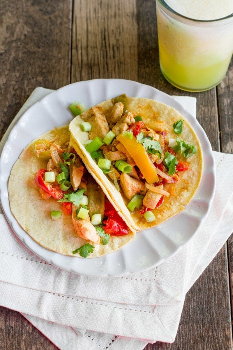 Two Slow Cooker Chicken Fajitas sit together 