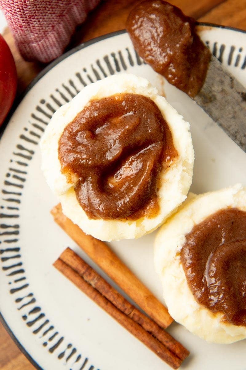 Close-up of apple butter spread onto biscuits.