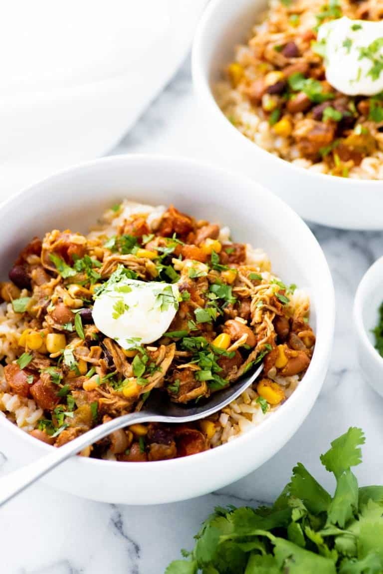 Side angle shot of Slow Cooker Summer Chicken Chili in a white bowl