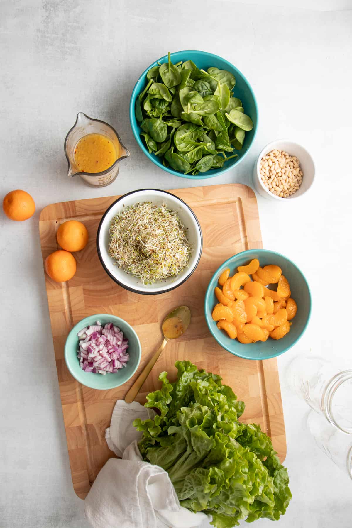 Ingredients for a sunshine mandarin salad in individual bowls.