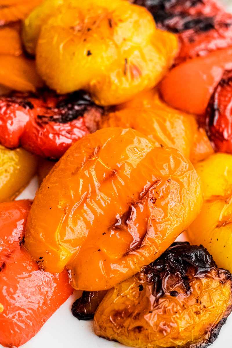 Tight view of grilled skin on bell pepper pieces.