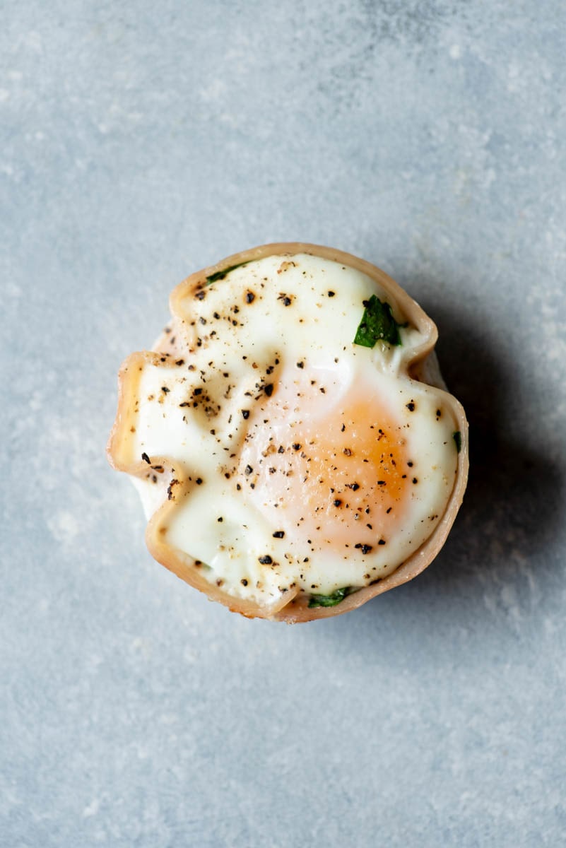 Top view of a turkey egg muffin on a light background.